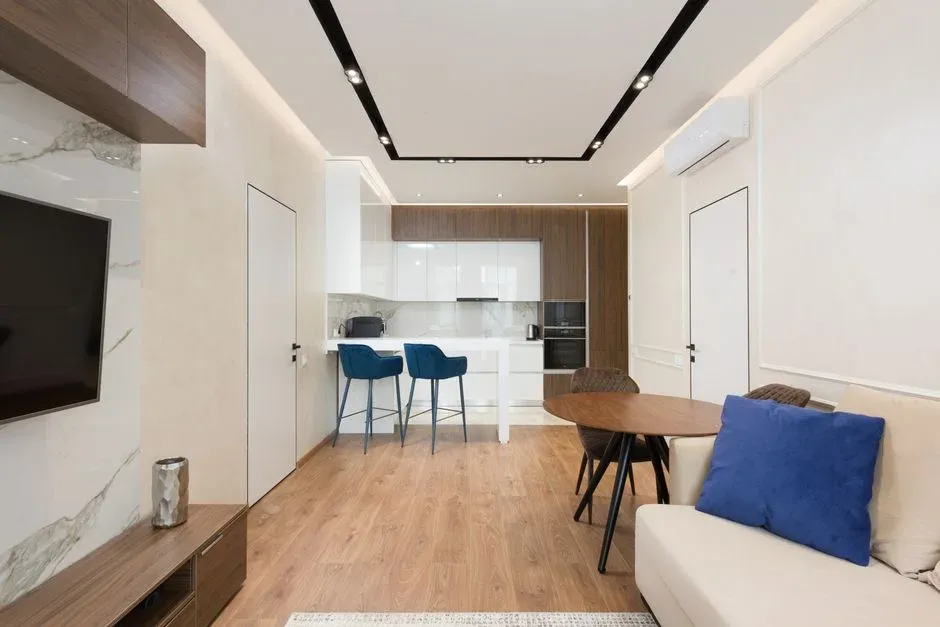 A furnished apartment living room with a sofa and decor