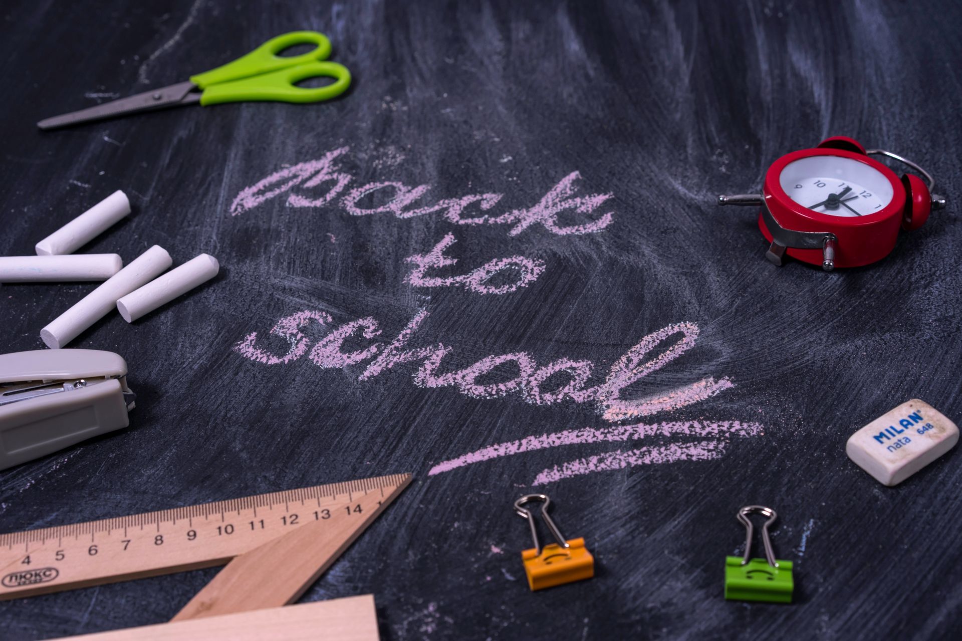 Chalkboard with school supplies